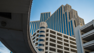 Concrete Bridge with multiple concrete buildings in the background skyline